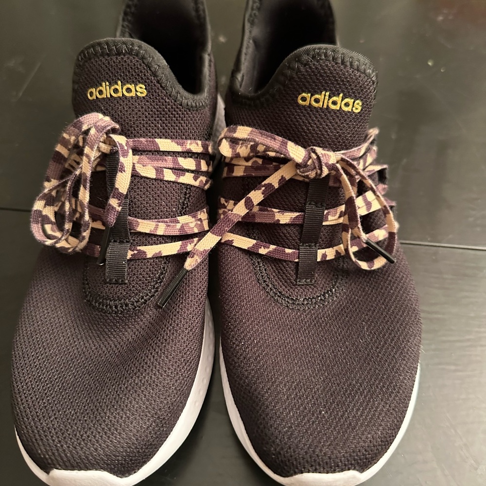 Gently used black adidas athletic shoe